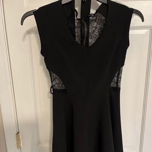 Black  mini dress with lace cut out, sides and back